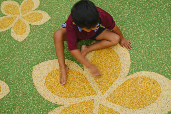 Safe for children to play on wet pour rubber surfacing.